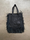 Black leather handbag with fringe