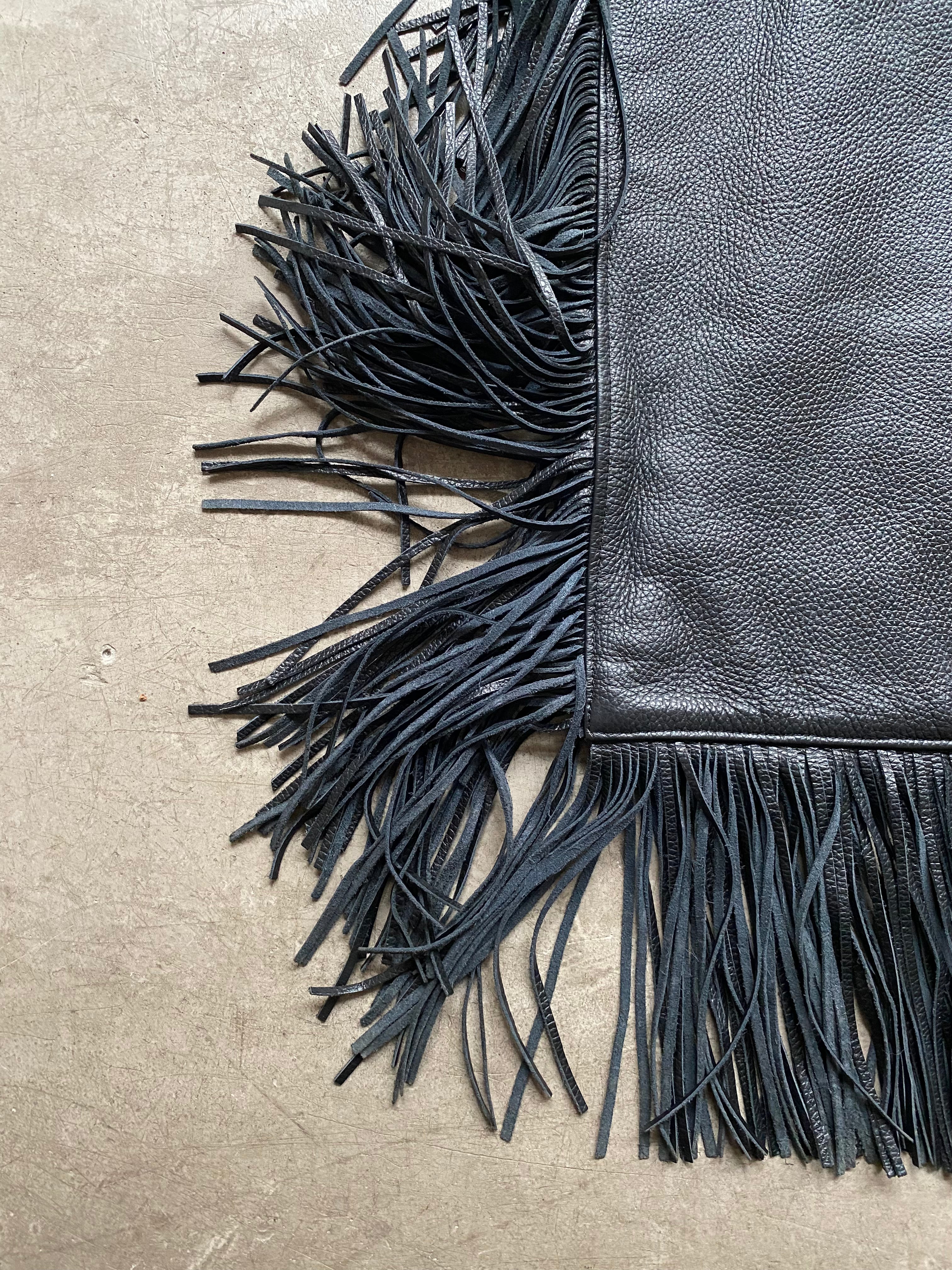 Black leather handbag with fringe
