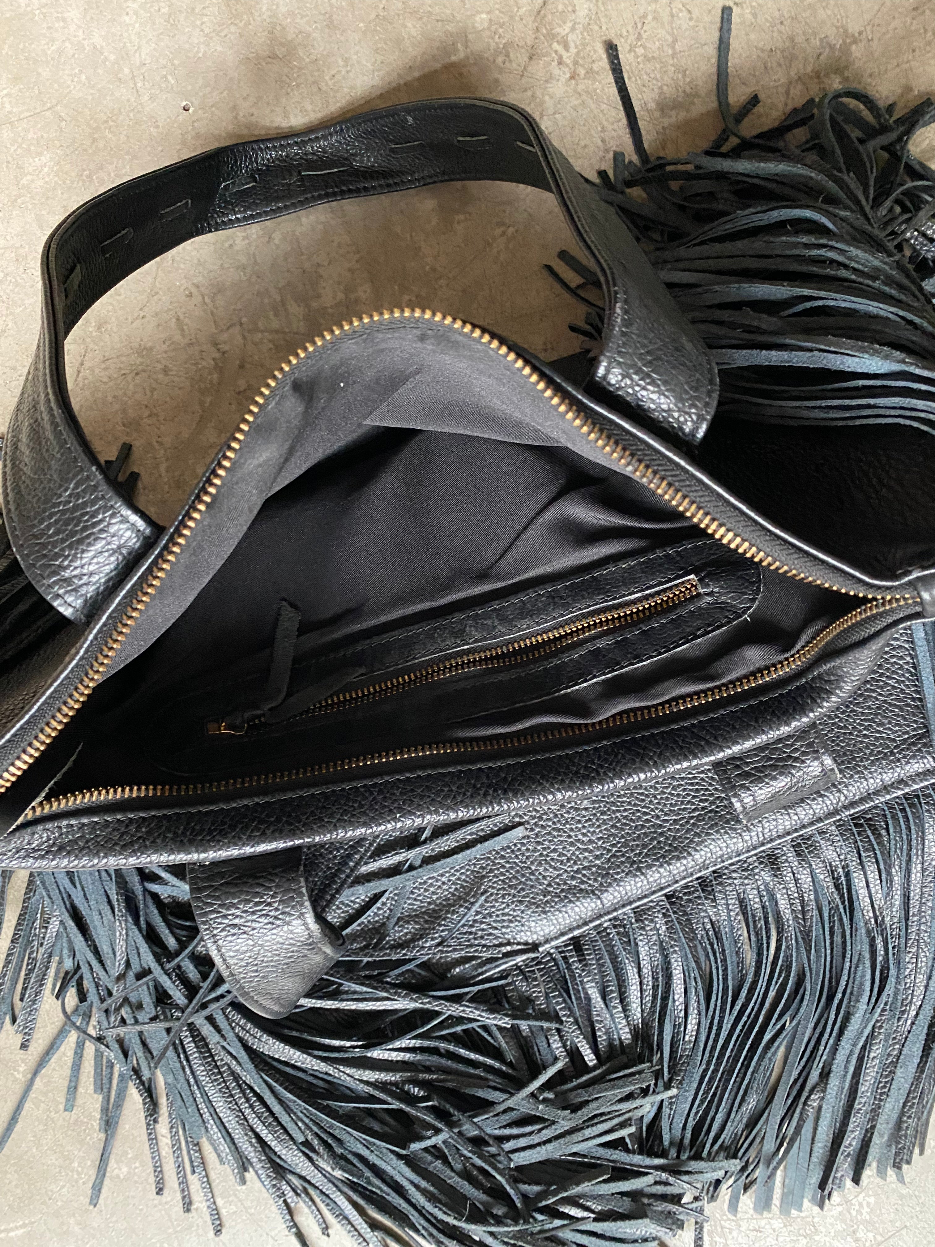 Black leather handbag with fringe